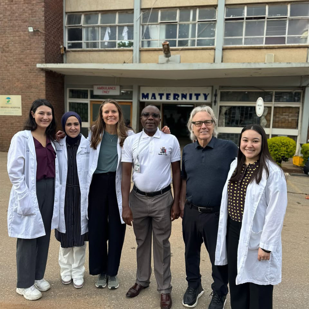 Dr. Bedimo with residents in Zambia
