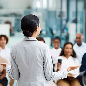A woman speaking at an event