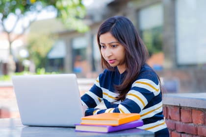person typing on a laptop