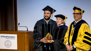 Jay Vijay Pandya, M.D., M.P.H., left, accepts the Excellence for Impact Award from Ambassador Hutchison and Dean Omer in honor of his outstanding contributions.