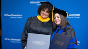 Organic Chemistry graduate Adriana Claudio Vázquez, M.S., (left) takes a celebratory photo with Neuroscience graduate Lidiette Angeles Perez, Ph.D.