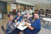Employees sampling the West Campus Building 3 cafeteria fare the day of the dedication ceremony.