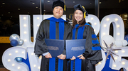 It’s a wrap for Molecular Biophysics graduate June Ho Hwang, Ph.D., (left) and Genetics, Development, and Disease graduate Huong Tra Ngo, Ph.D., as they celebrate the end of graduate school.