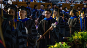 The academic procession enters the NB2.EEF Auditorium, led by Mace bearer Miguel Ángel Cano, M.P.H., Ph.D., Associate Professor.