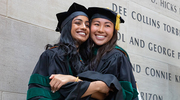 Sahiti Patibandla, M.D., (left) and Lucia Zhang, M.D., share a warm hug in celebration.