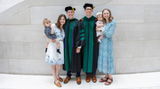 It’s a family celebration for Blaine Oldham, M.D. (center left), and Brenden Garrett, M.D., and their loved ones.