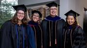 OSPH faculty gathering for a celebratory photo include: Michelle Ward, Assistant Director of Strategic Initiatives; Carolyn Smith-Morris, Ph.D., interim Chair and Professor, Department of Social & Behavioral Sciences; George Jackson, M.H.A., Ph.D., Professor; and Yang Xie, Ph.D., Professor.