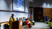 Dean Omer delivers closing remarks, marking the end of the historic inaugural commencement.