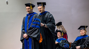 Biological Chemistry graduate Michael McConville, Ph.D., is hooded by Glen Liszczak, Ph.D., Assistant Professor of Biochemistry and Program Director of Biological Chemistry.