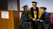 Sarah Allison Mayberry, M.P.H., left, receives the Hoffman Endowment Scholarship and the Alumni Memorial Scholar Award from Ambassador Hutchison and Dean Omer in recognition of her accomplishments.