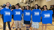 From left: Harrison Hicks, Matthew Cali, Ariana Ishaq, Anusha Naeem, and Pooja Kumar proudly hold up their match shirts.