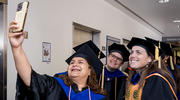 From left: OSPH faculty members Fauzia Malik, Ph.D., Associate Professor; Megan Mullins, Ph.D., Assistant Professor; and Amy Hughes, Ph.D., Associate Professor; grab a selfie before the processional honoring the Class of 2025.