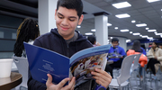 A high school student looks through a brochure at a Health Professions Recruitment and Exposure Program (HPREP) event in January. HPREP exposes students to medicine and science career opportunities through activities that include participation in a college fair and mentorship with UT Southwestern students.
