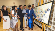 With the help of his family, Dru Annapureddy adds his headshot to the Match Day map.