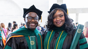 Yves Kenfack, M.D., (left) and Michelle Ibidapo, M.D., celebrate their graduation.