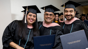 From left: Liliana Robles, M.P.H., Fabian Robles, M.P.H., and Noah Puente, M.P.H., share a proud moment after crossing the stage.
