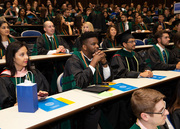 Students listen closely to instructions ahead of the Hooding Ceremony, which is a symbolic acknowledgment by the faculty to students who have attained a certain level of scholarly achievement.