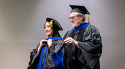 After years of dedication, Perot Family Scholars Medical Scientist Training Program graduate Julia Dan-Thanh Phan, M.D., Ph.D., is hooded by Sean Morrison, Ph.D., Director and Professor, Children’s Medical Center Research Institute at UT Southwestern.