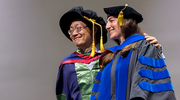 Cancer Biology graduate Samantha Golomb, Ph.D., shares a proud moment with her mentor, Siyuan Zhang, M.D., Ph.D., Associate Professor of Pathology.