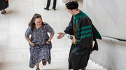 Tanner Hardy, M.D., extends the first of many helping hands that he will offer as a physician (to his wife, Gracee Hardy).