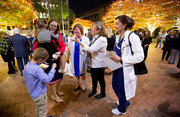 Dr. Jaclyn Albin entertains her children while catching up with Drs. Sharon Reimold, Robyn Horsager-Boehrer, and Ann Lutich.