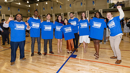 9 students pose with their new blue #utswmatch t-shirts.