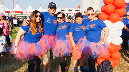 Five people in blue shirts at the Heart Walk
