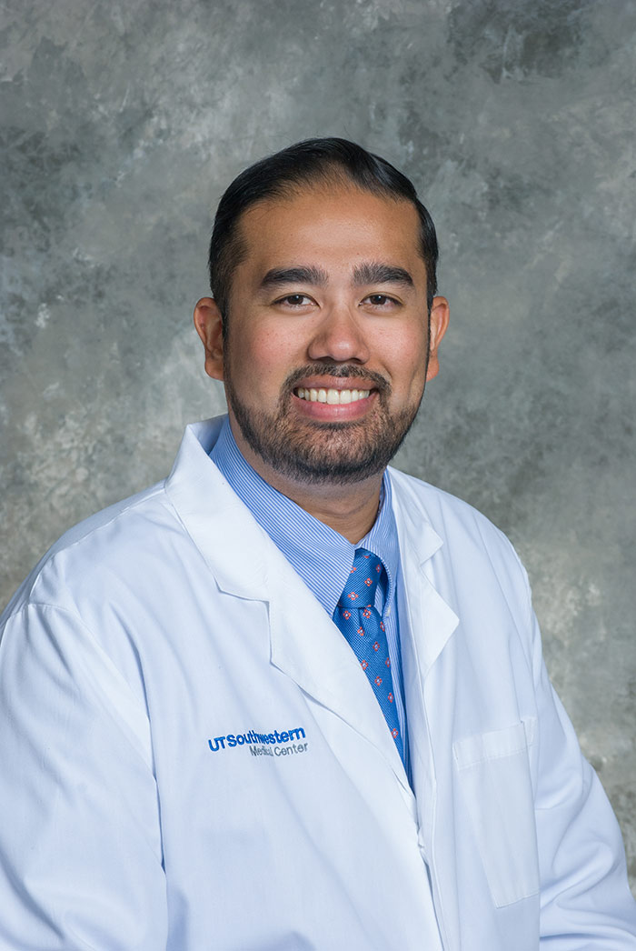 Dr. Richard Medford Man with short beard, dark hair, wearing white lab coat