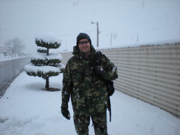 Robert Haas Man outdoors in the snow wearing military camo