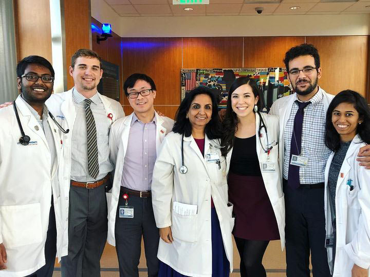 Mr. Umbach poses with students and medical students and mentors of the XX academic college. Group of people smiling
