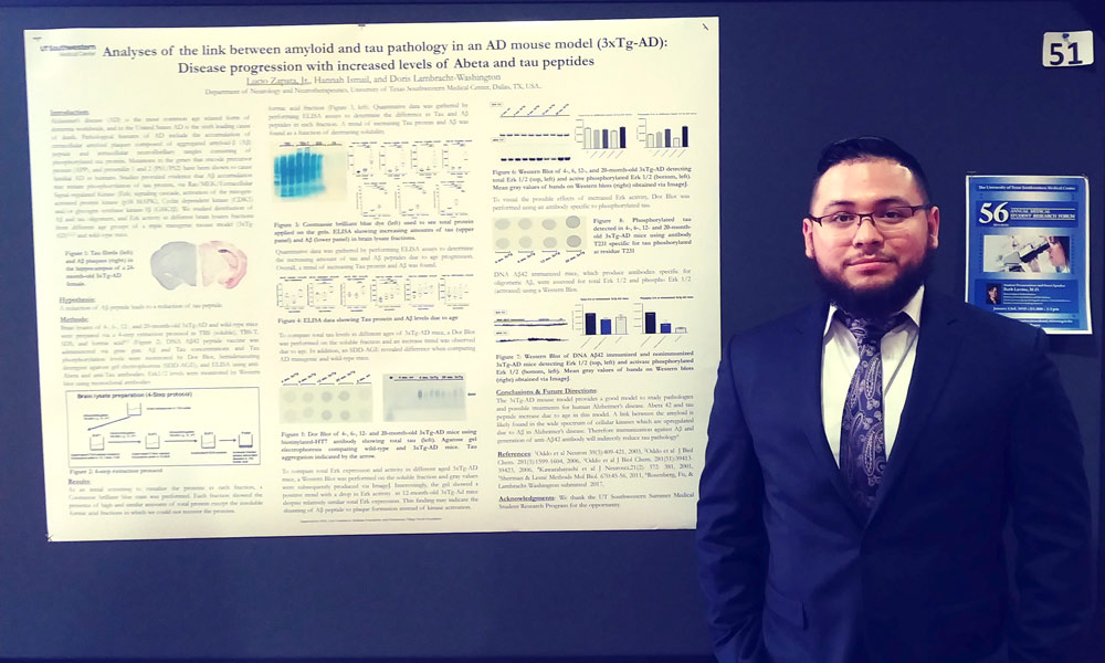 Mr. Zapata presents at UT Southwestern's 56th Annual Medical Research Forum in January 2018. Man in suit standing next to poster