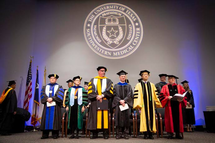Adademic leaders Academic leaders in black graduation gowns