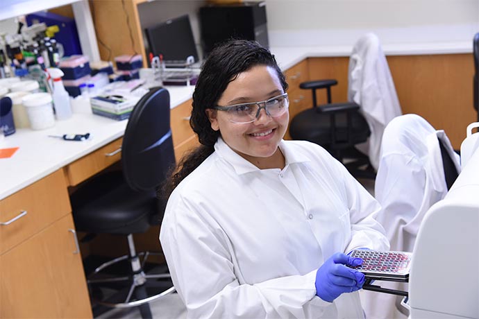 student in white coat