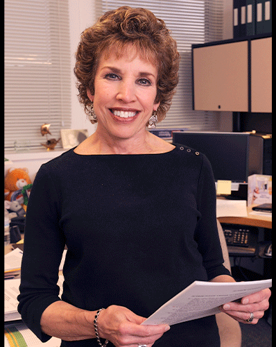 Carole Mendelson, Ph.D. Man in lab coat outside