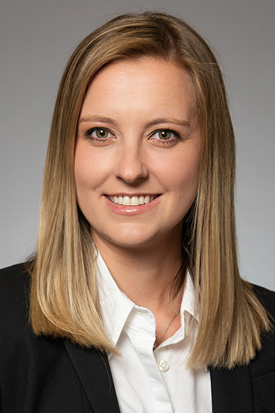 blonde, white shirt, black jacket