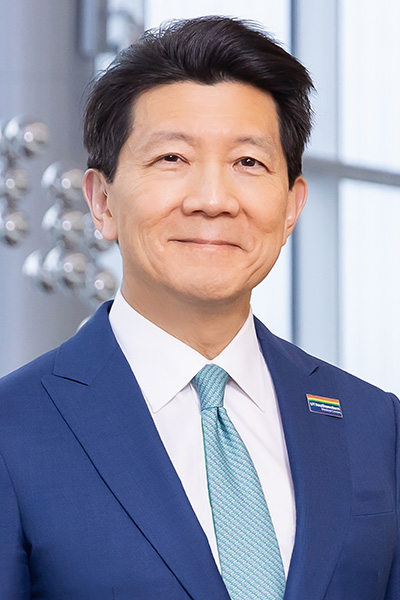 headshot of darkhaired Asian man in blue blazer and light blue tie Dr. Andrew Lee