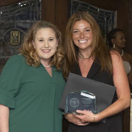Ellie Tuchaai receiving award from Amy Woods