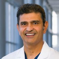 Kapil Anand, M.D., southeast Asian man, black hair, smiling