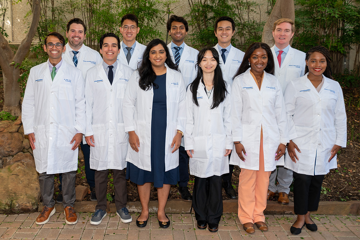 Cardiology welcomes our incoming class of first year fellows for 2024-25 2024-25 First Year Cardiology Fellows standing in a group in front of tress and schrubs