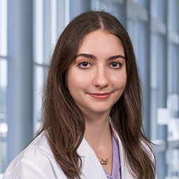 Dr. Carol Abousaab, wearing a white lab coat