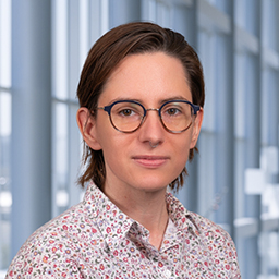 Jennifer Cardin wearing a floral print shirt, standing in the Clements University Hospital lobby