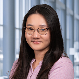 Nadia Lieu wearing a pink shirt, standing in the Clements University Hospital lobby