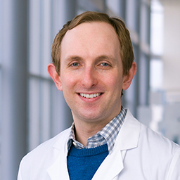 Dr. Jared Morphew wearing a white lab coat
