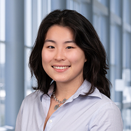 Elsa Zhang wearing a light blue shirt, standing in the Clements University Hospital lobby