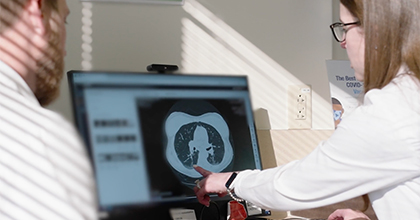 two doctors reviewing a pulmonary ct scan