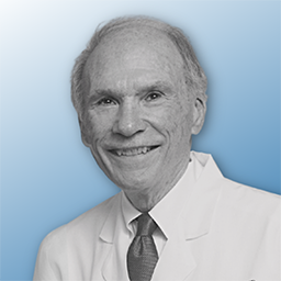 Dr. Daniel W. Foster, monotine on a blue gradient background