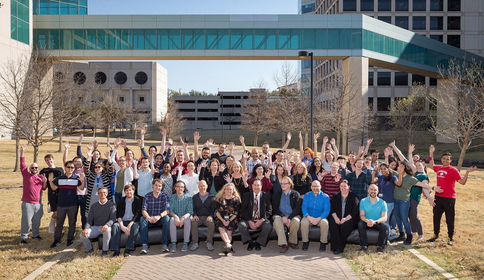 Spirited outdoor group photo of the microbiology department team