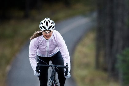 cyclist riding a bike on a winding road