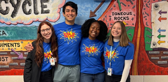 four students in KiPOW! t-shirts