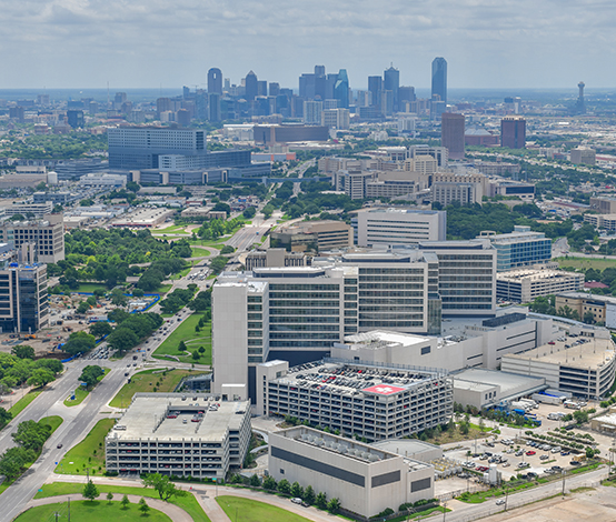 Aerial view of the UTSW campus against the backdrop of the Dallas skyline.